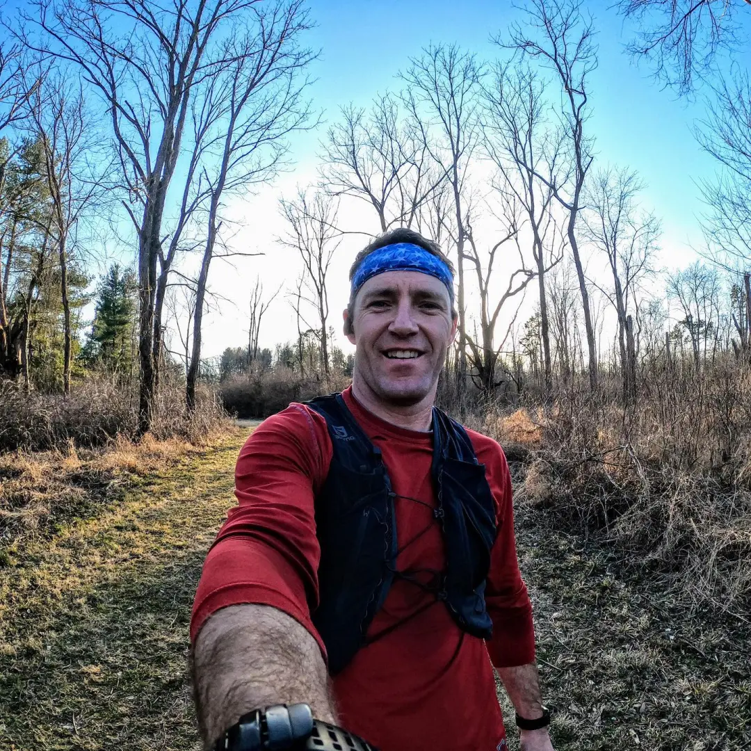 Josh smiling wearing a red shirt and a blue bandanna. Ultra success formula 